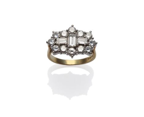 An 18 Carat Gold Diamond Cluster Ring, three baguette cut diamonds within a border of round brilliant cut diamonds, in white 