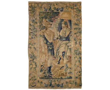 A 17th Century Flemish Historical Tapestry, depicting a seated monarch in Eastern costume beneath a tented structure in confe