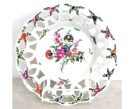 A First Period Worcester Porcelain Yellow Ground Basket, circa 1765, of circular form, painted in colours with sprays of summ