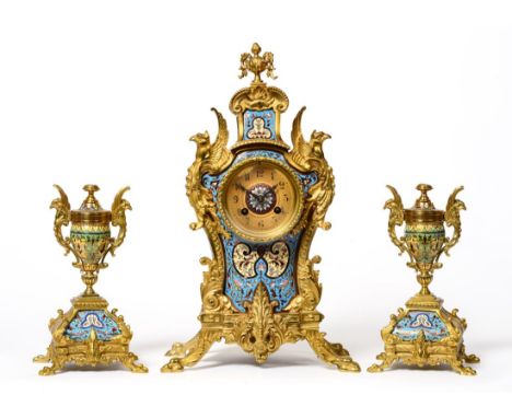 A Champleve Enamel Striking Mantel Clock with Garniture, circa 1890, highly elaborate case with multi-coloured champleve enam