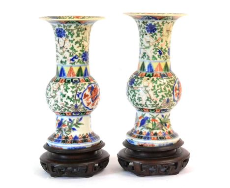 A Pair of Chinese Wucai Porcelain Vases, Wanli reign marks but probably later, painted with dragons in panels on a lotus scro