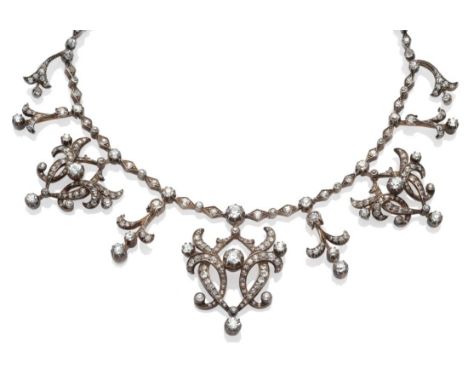 A Late 19th Century Diamond Necklace, of typical scroll and spray form, three graduated drops alternate with simpler drops, o