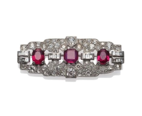 An Art Deco Ruby and Diamond Brooch, the plaque brooch inset with old cut and baguette cut diamonds, a step cut ruby and two 