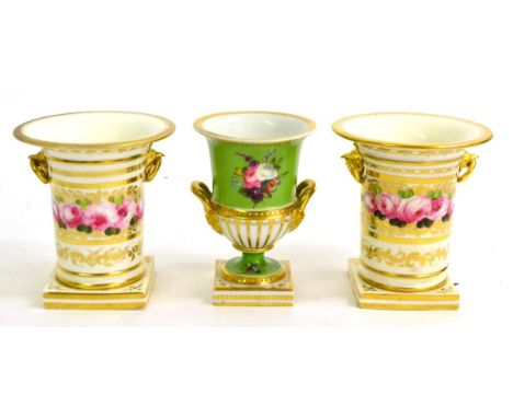 A Pair of English Porcelain Vases, circa 1820, of cylindrical form with flared rims and ring handles, painted with a band of 