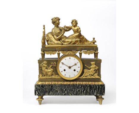 An Empire Ormolu Striking Mantel Clock, signed Bergmiller a Paris, surmounted with a figure reclining on a bed with an infant