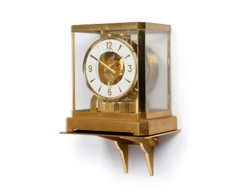 An Atmos Clock, signed Jaeger LeCoultre, 20th century, glass panels, white dial with dagger and Arabic numerals, movement num