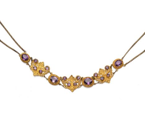 An Amethyst Set Collar Necklace, set with oval cut amethysts in bead frames, alternating with ornate foliate panels, also ins