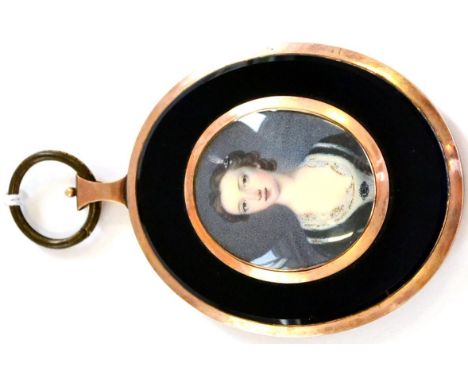 English School (early 19th century) Portrait miniature of a young lady, with a pearl and flower hair clip and black dress wit