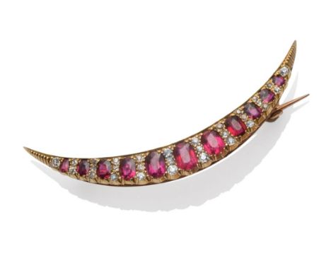A Ruby and Diamond Crescent Brooch, circa 1880, the graduated oval mixed cut rubies alternate with old cut diamonds, in yello