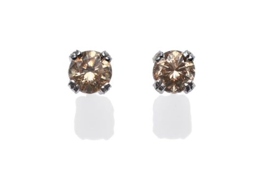 A Pair Of Cognac Diamond Earrings Each Round Brilliant Cut Auction Date