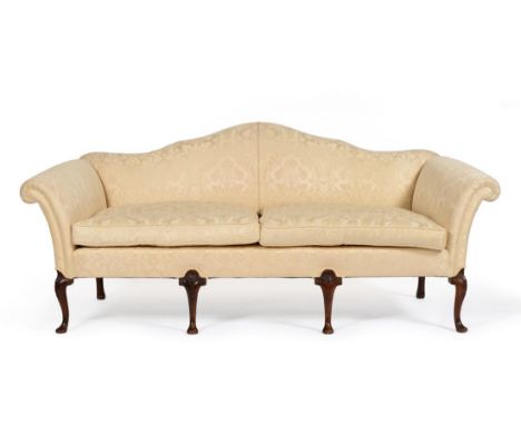 A George II Style Sofa, probably 19th century, upholstered in cream floral silk, with humpback rounded arm supports and two s