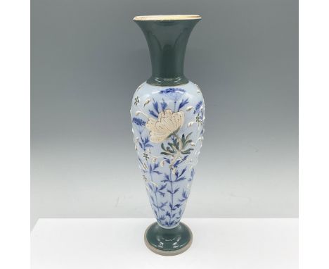 A beautiful footed flower vase with a cyan-colored neck and foot. The vase is decorated in a light blue glaze with hand paint