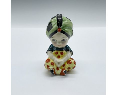 Rare hand decorated figure of a baby in a light green turban with black square patterns, dark turquoise top, and pale yellow 