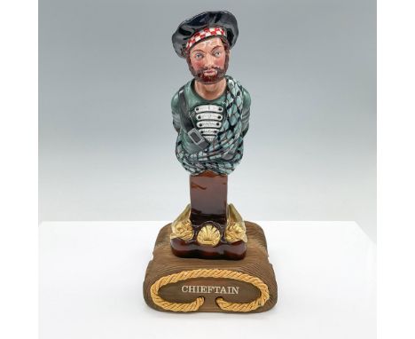 Limited edition porcelain figure. Depicts a Highland chieftain, and golden medieval dolphins around the base. Green, black an