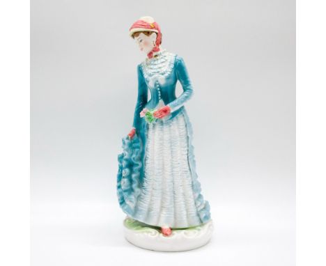 Glossy elegant figure of a woman in a sapphire blue dress with white ruffles, and rose pink gloves. 'The Victoria &amp; Alber
