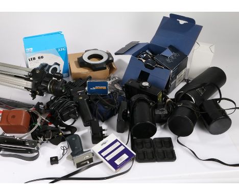 Camera accessories to include lens cases, batteries, tripod etc