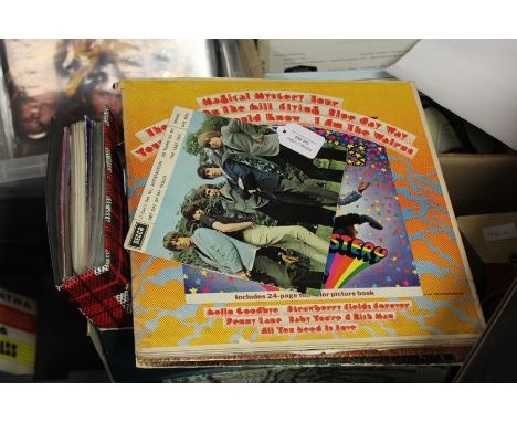 Collection of LPs and 45 rpm records to include The Rolling Stones 45, The Beatles Sgt Peppers Lonely Hearts Club Band and Ma