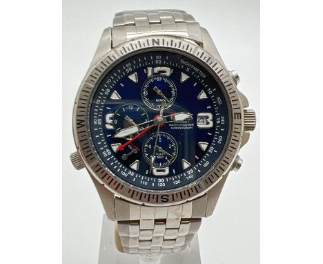 A G-942 chronograph watch by Fila. Stainless steel case and strap with blue face. Luminous hour markers and hands. Date funct