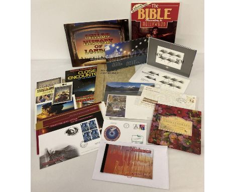 A quantity of assorted ephemera to include first day covers and commemorative stamp sets. Lot includes: Millennium Moment Com