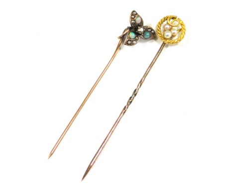 Two stick pins, comprising a stick pin set with opal and seed pearl with three leaf clover top, unmarked, 5cm high, and a sti