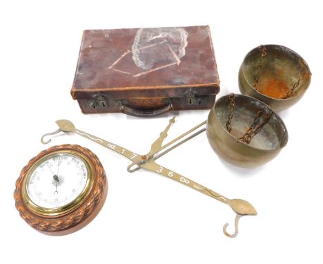 A set of brass hand scales, aneroid barometer in carved oak case, and a suitcase. (AF)