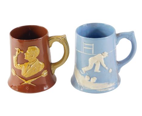 Two pottery tankards, comprising a Dartmouth pottery Devon dart tankard, on treacle glaze, 13cm high, and blue cream ware bow