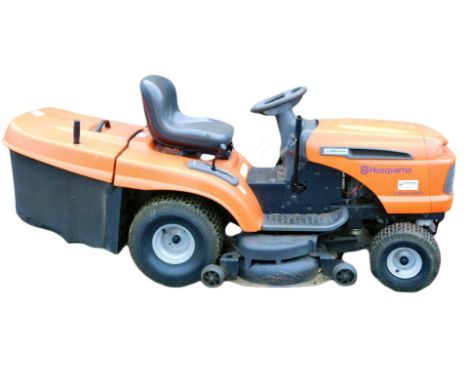 A Husqvarna CTH 210 XP petrol ride on mower, with Kawasaki engine and six speed gears. 