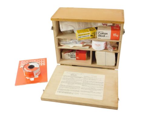 A late 20thC laminated first aid box, with some contents, stamped Office's, Shops and Railway premises at 1963, 28cm wide. 