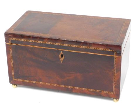 A 19thC mahogany and chequer banded tea caddy, the hinged lid enclosing two lidded divisions, on brass paw feet, 25cm wide. 