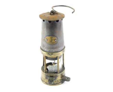 A brass and iron miner's lamp, lacking name plate, etc., (glass AF), 25cm high. 
