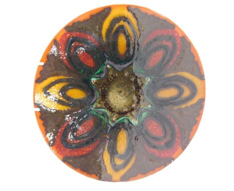 A Poole Delphis charger, decorated with ovals in shades of orange, green, yellow, etc., 27cm diameter. 
