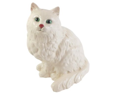 A Royal Doulton ceramic model of a white cat, 21cm high, boxed. 