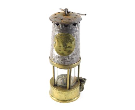 A Protector Type SE brass and steel miner's lamp, 25cm high. 
