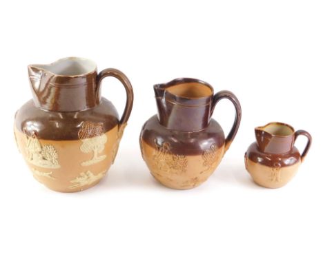 Three Royal Doulton brown stoneware jugs, each decorated in typical form with tavern scenes, hunting, etc., 18cm, 14cm and 8c