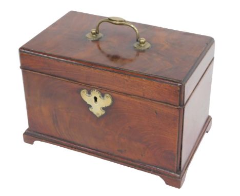 A George III mahogany tea caddy, the hinged top with a brass handle enclosing three divisions to the interior, on bracket fee
