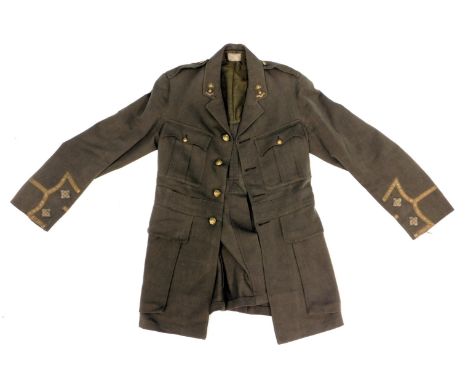 A green Army dress jacket, with applique and military buttons. 