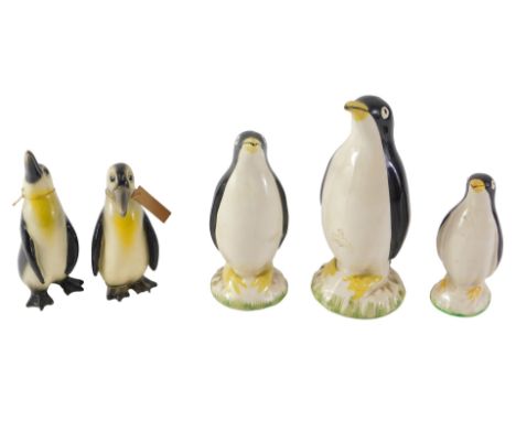 A graduated set of three Carlton ceramic penguins, and two 19thC ceramic penguins, the largest 15cm high. (5) 
