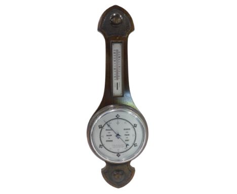 A 1920s/30s barometer, in mahogany case with silver coloured dial, and thermometer, 74cm high. 