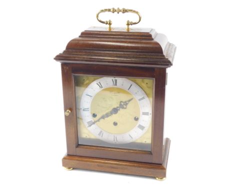 A Comitti mantel clock, with Westminster chime, and eight day movement, in a mahogany case, 35cm high. 