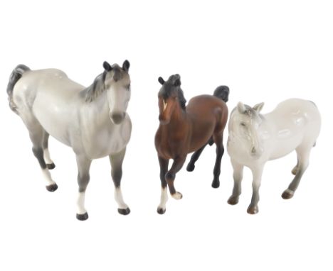 Three large ceramic horses, comprising a Branksome china grey horse, a large grey dapple Beswick horse, 23cm high, and a Besw