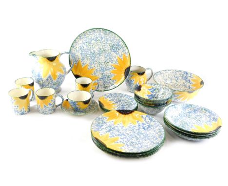 Various items of Poole hand painted pottery, each decorated with sunflowers on a mottled green ground to include dinner plate