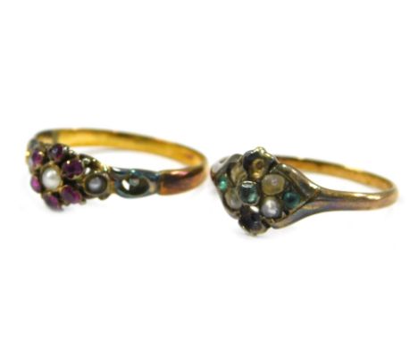 Two dress rings, comprising an Edwardian cluster ring, set with garnets and seed pearls, on a yellow metal band, unmarked, ri