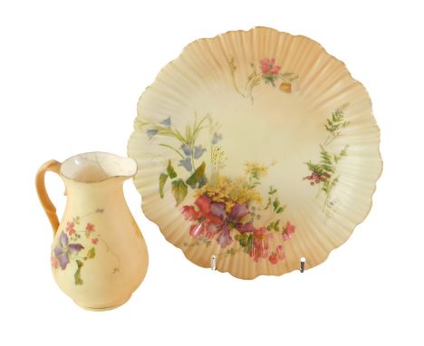 A Royal Worcester blush ivory cabinet plate, with fanned border and painted decoration of flowers, 21cm wide, and associated 