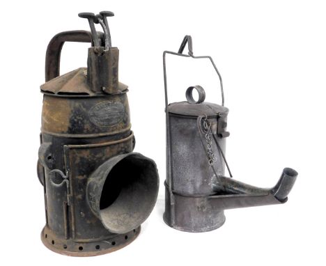 A railway hand lamp, GWR pattern, 33cm high, and a road worker's oil lamp, circa 1915, 32cm high. (2)