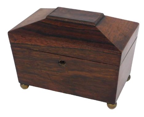 A Victorian rosewood sarcophagus shaped tea caddy, the hinged lid enclosing two lidded divisions, 20cm wide. 