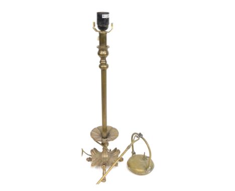 A 19thC brass table lamp, converted to electricity, on a moulded leaf base, 62cm high, etc. (2)