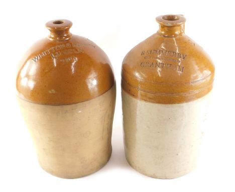 A stoneware flagon stamped R Summersby Grantham, 40cm high (AF), and another stamped Whitton and Ashley Lincoln, 39cm high. 