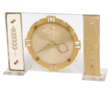 A 1960s mantel clock, with Perspex rectangular moulding, with a cold painted circular dial, 16cm high, 25cm wide. (AF) 