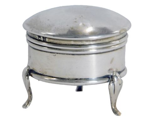 A George V silver ring box, of circular plain design, on tripod feet, with a blue lined interior, Birmingham 1919, 4cm high, 