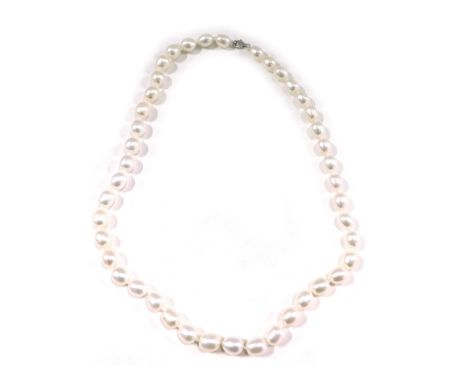 A pearl necklace, with white lustre finish beads, on a knotted string strand, of varying sizes, the largest 10mm wide, the sm